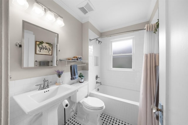 full bathroom with tile patterned floors, sink, toilet, ornamental molding, and shower / tub combo with curtain