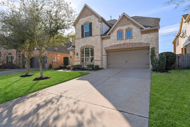 view of front of property with a front yard and a garage