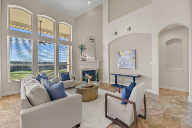 living room with a high ceiling