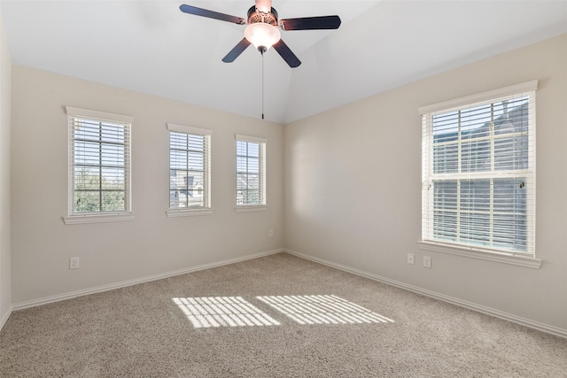 carpeted empty room with lofted ceiling and ceiling fan