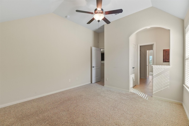 interior space featuring lofted ceiling and ceiling fan