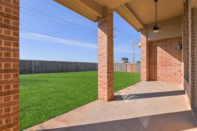 view of yard with a patio and ceiling fan