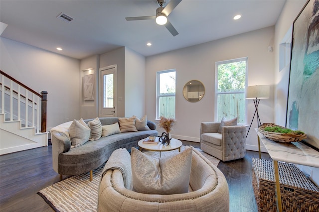 living room with ceiling fan and dark hardwood / wood-style flooring