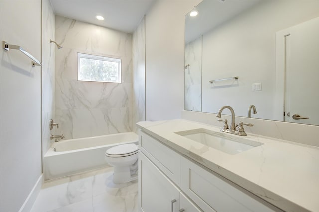 full bathroom featuring vanity, tiled shower / bath combo, and toilet