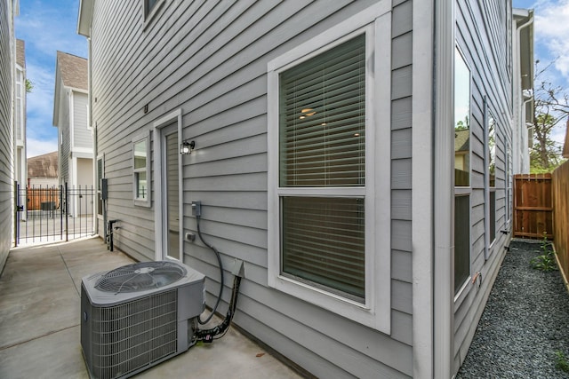 exterior space with a patio and central AC