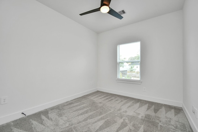 carpeted empty room featuring ceiling fan