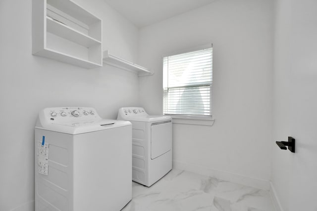 washroom with washer and dryer