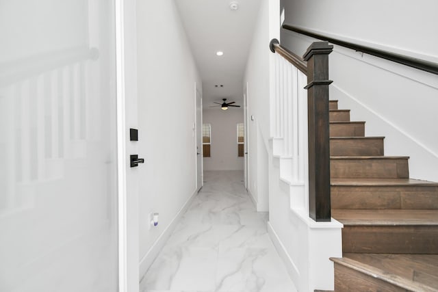 stairway with ceiling fan