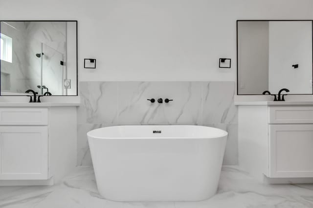 bathroom featuring tile walls, separate shower and tub, and vanity