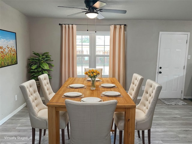 dining room featuring wood-type flooring and ceiling fan