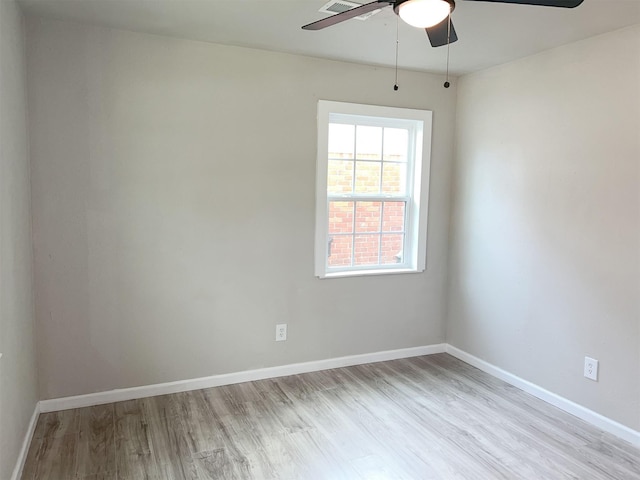 unfurnished room with light wood-type flooring and ceiling fan