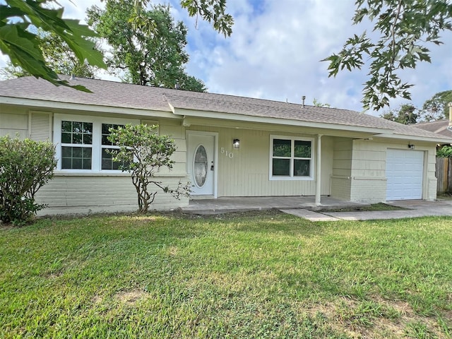 ranch-style home with a front yard and a garage