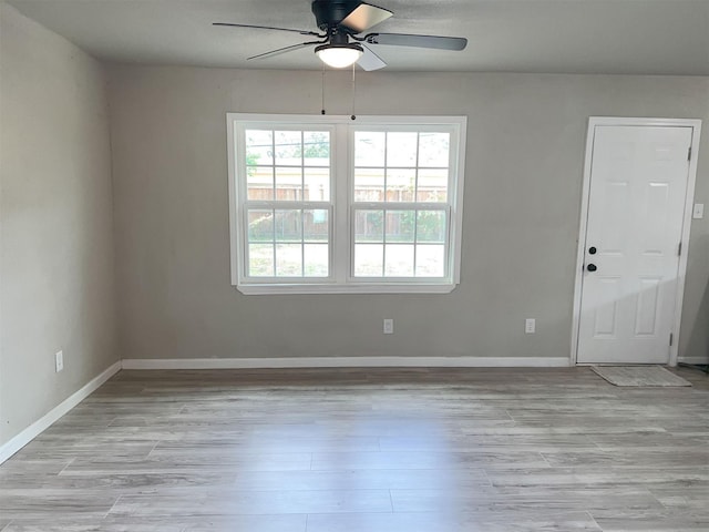 spare room with ceiling fan and light hardwood / wood-style flooring