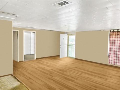 spare room featuring light hardwood / wood-style floors