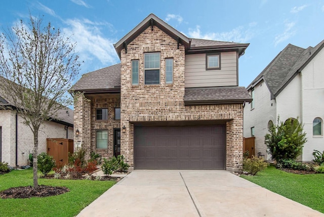 view of property with a front lawn and a garage