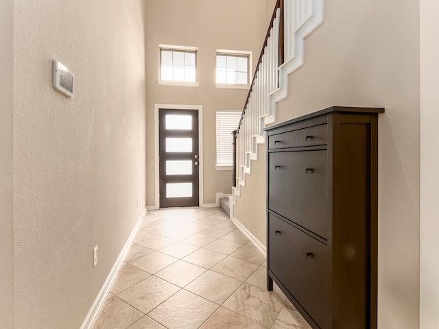 foyer with a towering ceiling