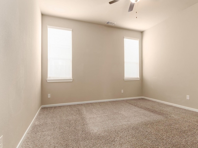 carpeted empty room with ceiling fan