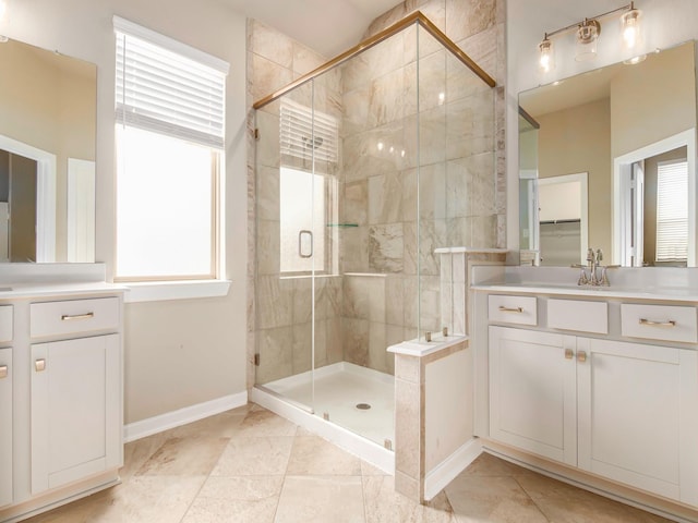 bathroom with vanity and a shower with shower door