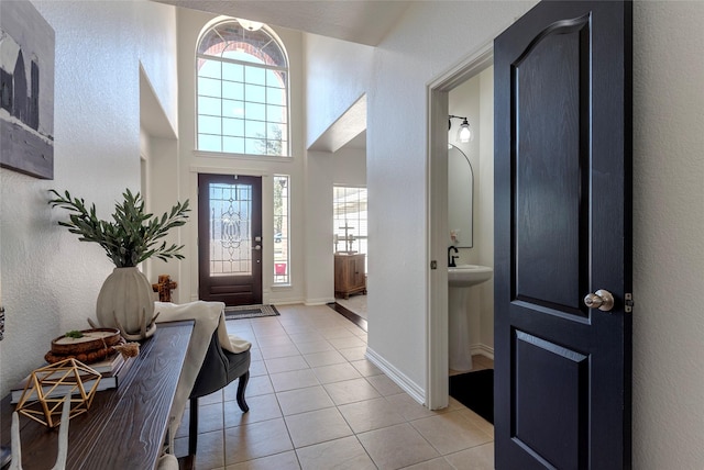 foyer entrance featuring light tile patterned floors