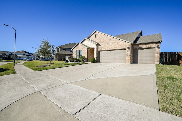 ranch-style home with a front yard and a garage