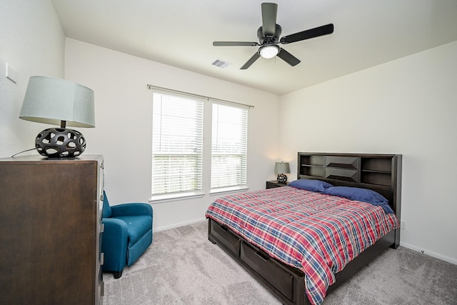 bedroom featuring ceiling fan and light colored carpet