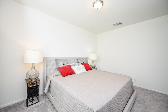 bedroom with light colored carpet