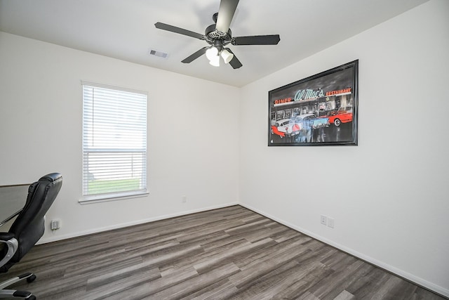 unfurnished office featuring ceiling fan and hardwood / wood-style flooring