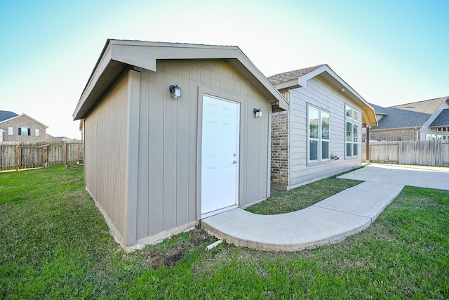 view of outbuilding featuring a yard