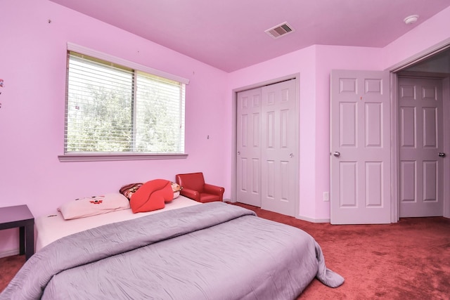 bedroom featuring a closet and carpet flooring