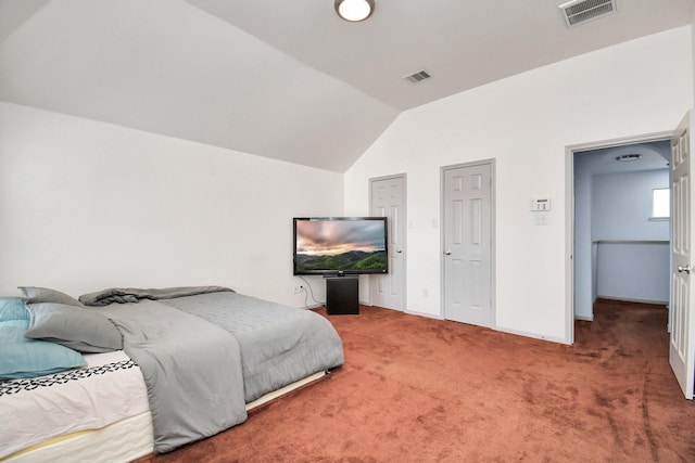 bedroom featuring vaulted ceiling and carpet flooring