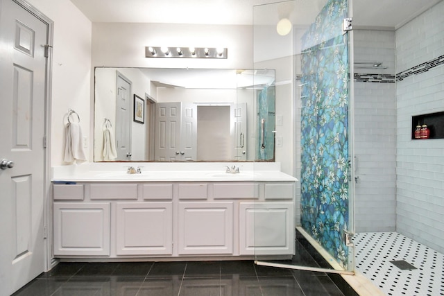 bathroom featuring vanity, walk in shower, and tile patterned flooring