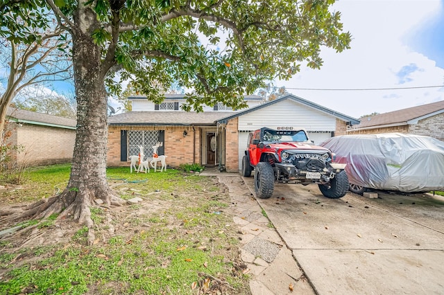 ranch-style house featuring a garage