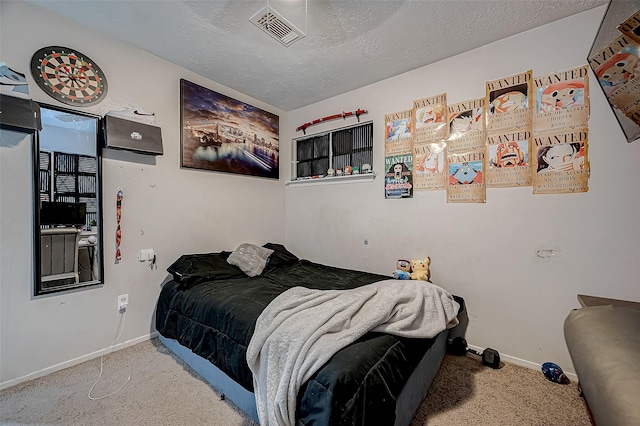 carpeted bedroom with a textured ceiling