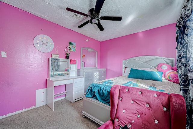 bedroom featuring ceiling fan, light carpet, and a textured ceiling