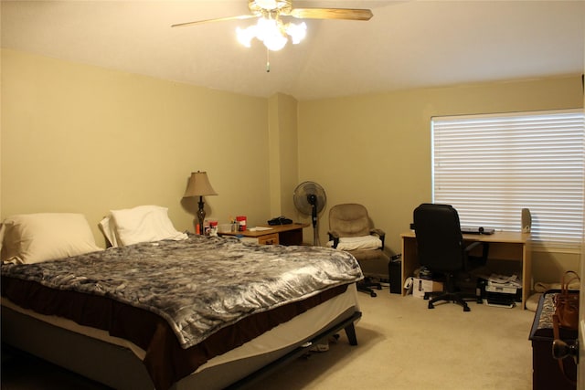 carpeted bedroom featuring vaulted ceiling and ceiling fan