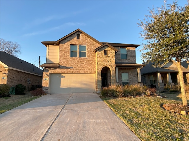 view of front of property with a front yard and a garage