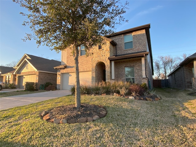 view of front of home featuring a front lawn and a garage