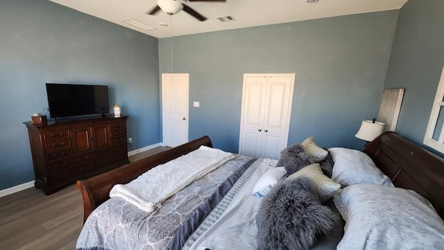 bedroom with ceiling fan, wood-type flooring, and a closet