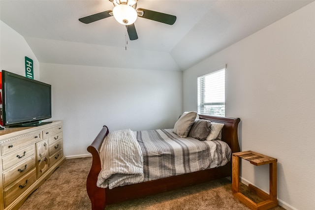 bedroom featuring vaulted ceiling, ceiling fan, and dark carpet