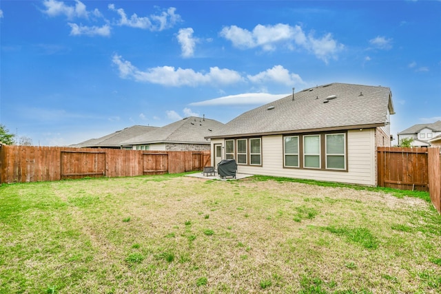 back of property featuring a lawn and a patio