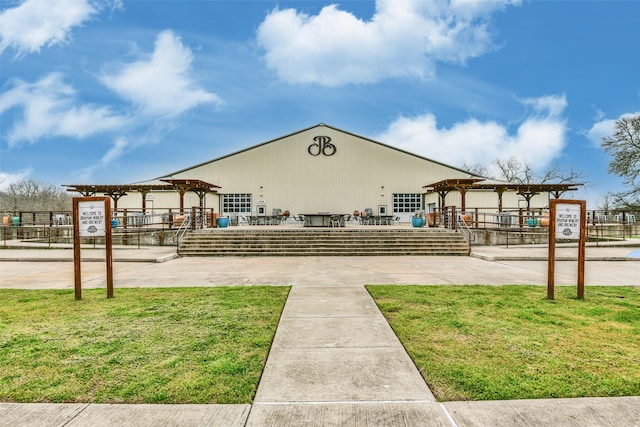 view of home's community with a lawn and a gazebo