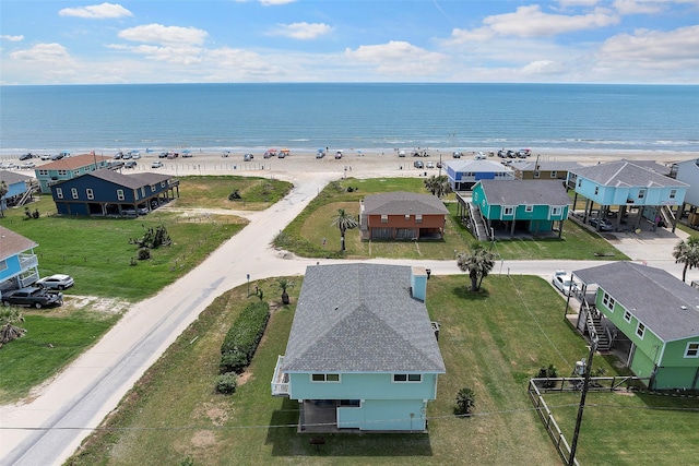 drone / aerial view featuring a view of the beach and a water view