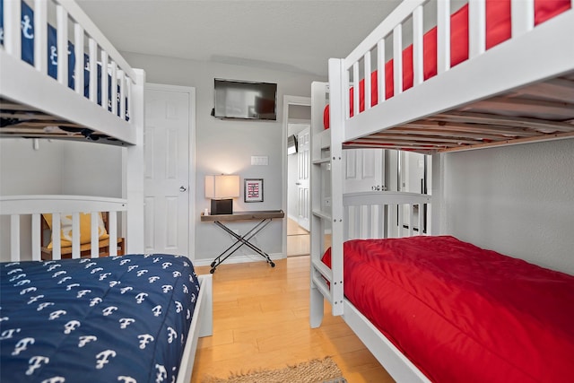 bedroom with wood-type flooring