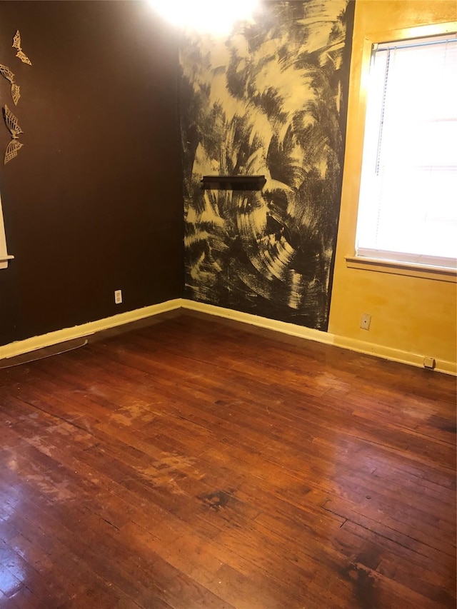 spare room featuring dark hardwood / wood-style flooring