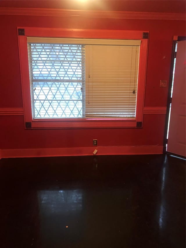 unfurnished room featuring ornamental molding