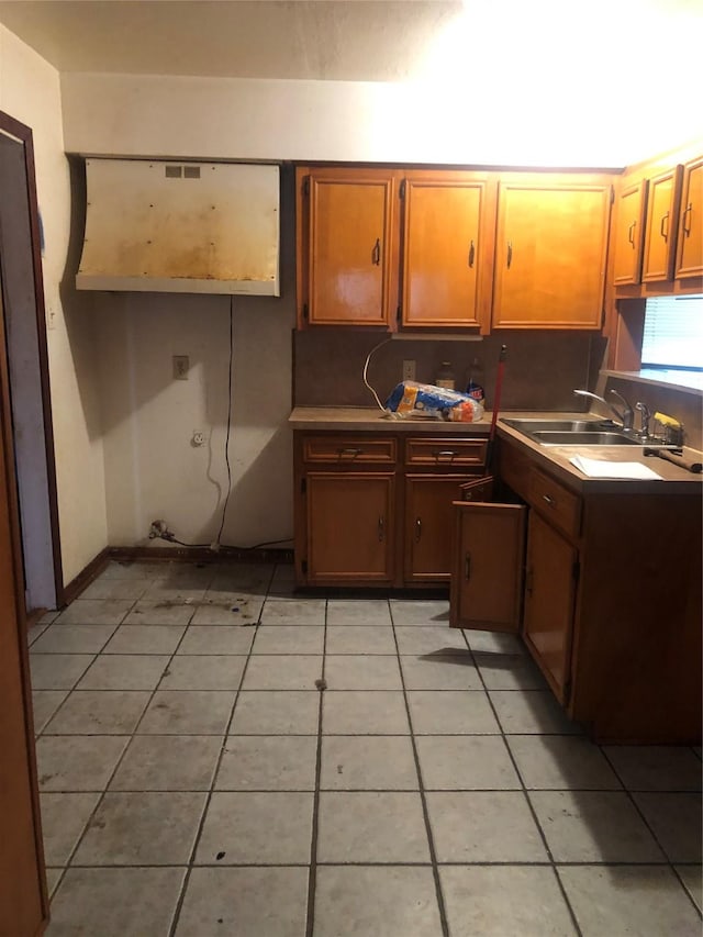 kitchen with sink and light tile patterned floors