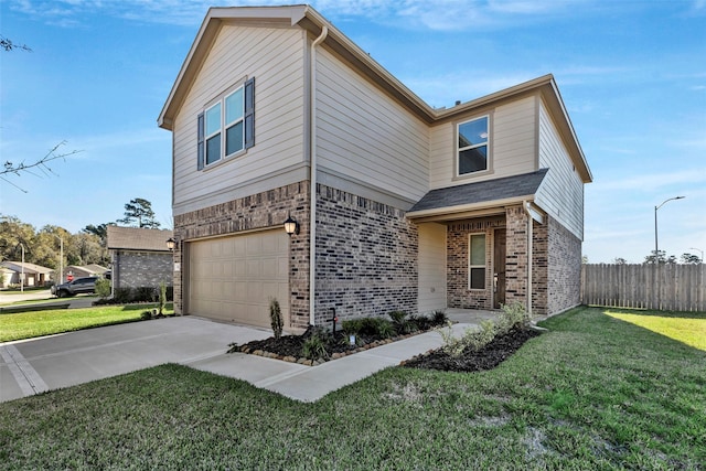 view of front of home with a front yard and a garage