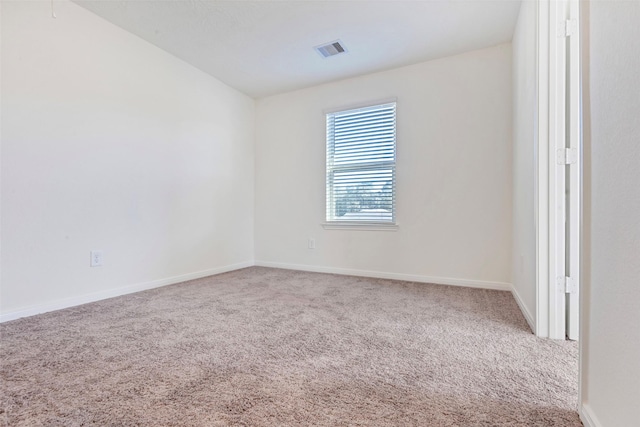 spare room featuring carpet floors