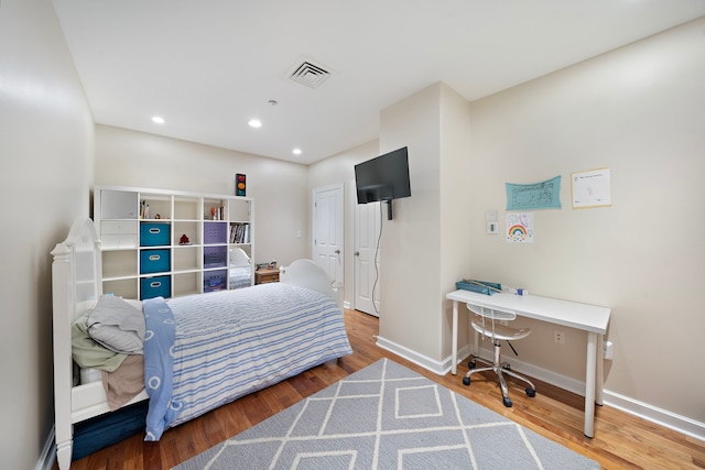 bedroom featuring hardwood / wood-style floors