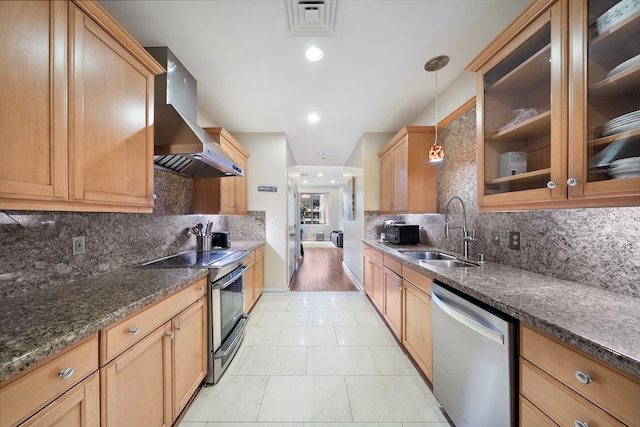 kitchen featuring pendant lighting, ventilation hood, sink, light tile patterned floors, and stainless steel appliances